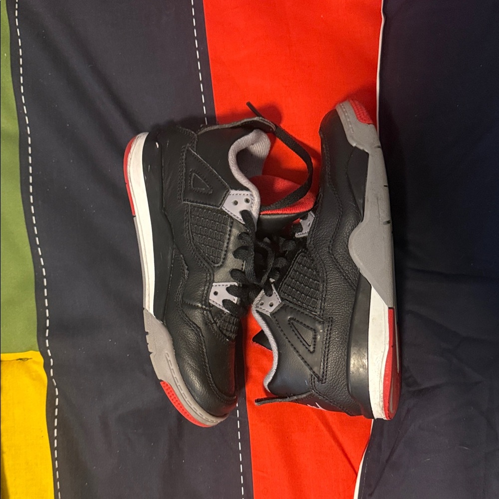 Jordan 4 Bred Reimagined 13C Black and Gray Sneakers with Red Accents